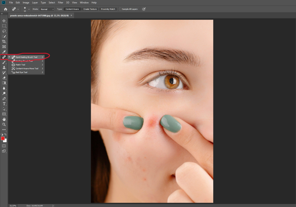 Select the spot healing brush tool