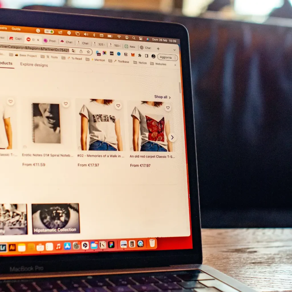 Laptop screen showing a list of clothes in the Product Video vs Photos Ecommerce article in Dropicts.com